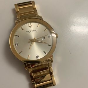 Gold Bulova men watch
